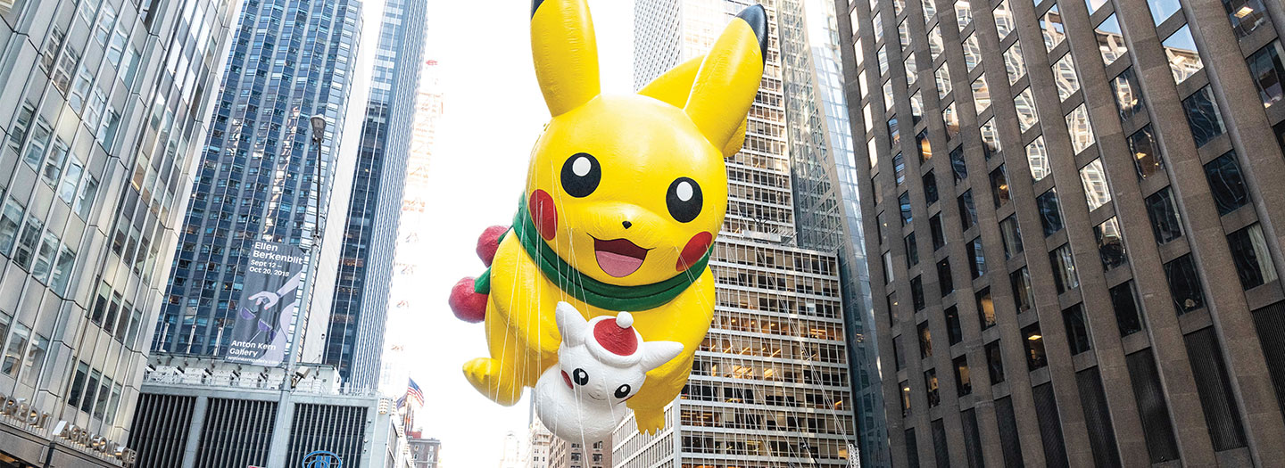 Giant Pokemon balloons at a parade.